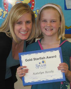 Katelyn with Starfish Award certificates